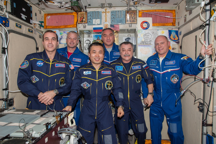 Captain Koichi Wakata, Expedition 39 Crew Member, International Space Station ISS039 E 011174  11 April 2014      Inside the Zvezda service module on the Earth orbiting International Space Station, the six Expedition 39 crew members face the camera during a call with Russian President Vladimir Putin. From left to right are NASA astronauts Rick Mastracchio and Steve Swanson, both flight engineers  Commander Koichi Wakata of the Japan Aerospace Exploration Agency  JAXA , and cosmonauts Alexander Skvortsov, Mikhail Tyurin and Oleg Artemyev, all flight engineers with Russia s Federal Space Agency  Roscosmos .