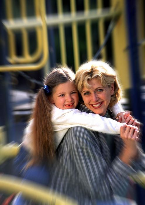 Mother and daughter portrait on playground
