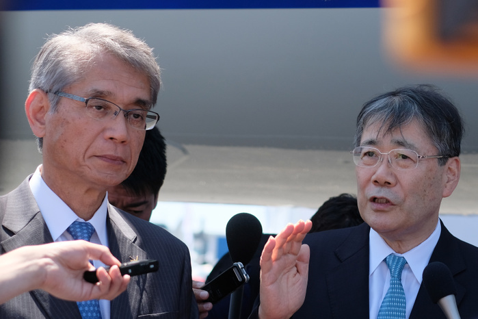2017 Paris Air Show Shunichi Miyanaga  R , Mitsubishi Heavy Industries  President and Chief Executive Officer and Hisakazu Mizutani , Mitsubishi Aircraft Corporation s president, are surrounded by the media as they answers questions in front of the third Flight Test Aircraft  FTA 3  of Mitsubishi Regional Jet  MRJ  at the Le Bourget Airport, a day before the opening of the 2017 Paris Air Show on June18, 2017, in Paris, France.  Photo by Yuriko Nakao AFLO 
