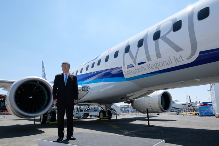 2017 Paris Air Show Shunichi Miyanaga, Mitsubishi Heavy Industries  President and Chief Executive Officer, poses in front of the third Flight Test Aircraft  FTA 3  of Mitsubishi Regional Jet  MRJ  at the Le Bourget Airport, a day before the opening of the 2017 Paris Air Show on June18, 2017, in Paris, France.  Yuriko Nakao AFLO 
