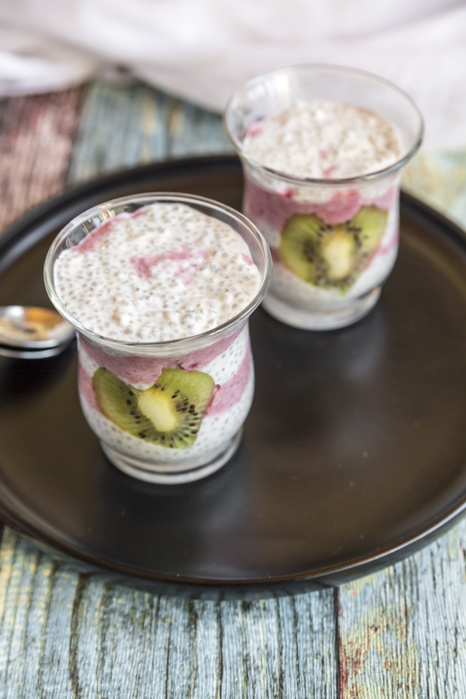 Two glasses of chia pudding with heart-shaped kiwi slices