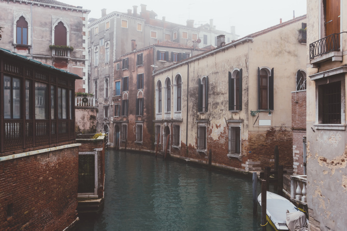 Italy View of misty canal and old buildings, Venice, Italy