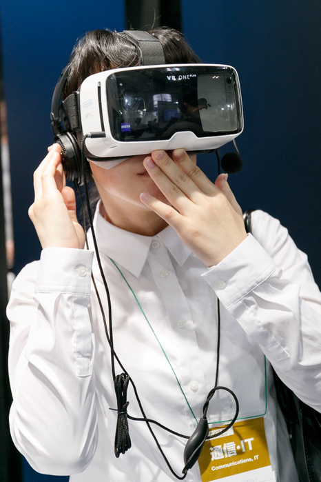 CONTENT TOKYO 2017 A woman tests a virtual reality glasses at CONTENT TOKYO 2017 at Tokyo Big Sight on June 28, 2017, Tokyo, Japan. New technologies such as Artificial Intelligence  AI , Virtual Reality  VR  and Augmented Reality  AR  are introduced during the three day trade show where 1760 exhibitors from the entertainment content industry will attend. Organizers expect that the event will draw some 63,000 visitors.  Photo by Rodrigo Reyes Marin AFLO 