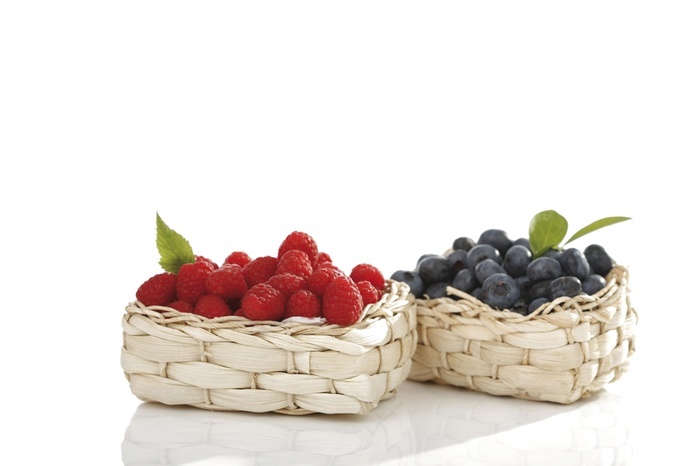   Raspberries and Blueberries in bast baskets