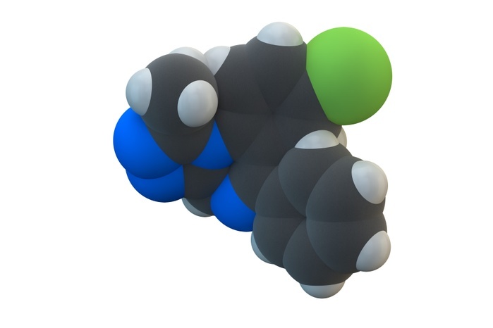 Alprazolam sedative drug molecule Alprazolam sedative and hypnotic drug  benzodiazepine class  molecule. Chemical formula is C17H13ClN4. Atoms are represented as spheres: carbon  grey , hydrogen  white , chlorine  green , nitrogen  blue . Illustration.