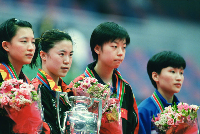 Women's Singles winners,
MAY 5, 2001 - Table Tennis : (L-R) Ling Lin of China (silver), Nan Wang of China (gold), Yining Zhang of China (bronze) and Yun Mi Kim of North Korea (bronze) celebrate on the podium after the Women's Singles at the 2001 World Table Tennis Championships in Osaka, Japan.
(Photo by AFLO SPORT) [0006]