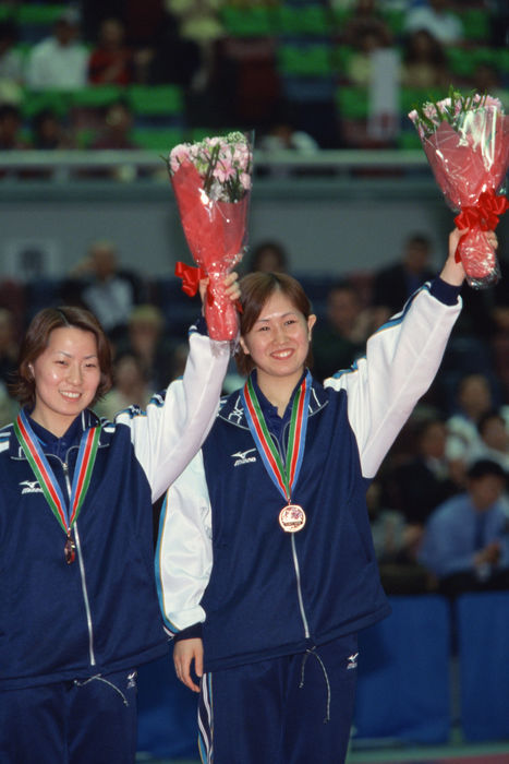 Mayu Kawagoe, Akiko Takeda (JPN)
MAY 6, 2001 - Table Tennis : Mayu Kawagoe (R) and Akiko Takeda (L) of Japan celebrate after winning the bronze medal in the Women's Doubles at the 2001 World Mayu Kawagoe (R) and Akiko Takeda (L) of Japan celebrate after winning the bronze medal in the Women's Doubles at the 2001 World Table Tennis Championships in Osaka, Japan.
(Photo by AFLO SPORT) [0006].
