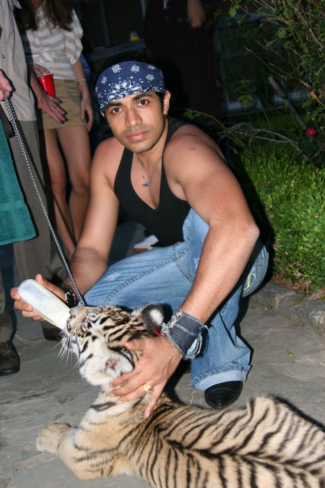 Fashion Designer Anand Jon Alexander Anand Jon, Jul 02, 2006 : Anand Jon and Michelle Rodriguez with Nature Santuary Tiger. Private House. Sunday, July 02, 2006. East Hampton, NY, USA  Photo by Celebrity Vibe AFLO   2361 