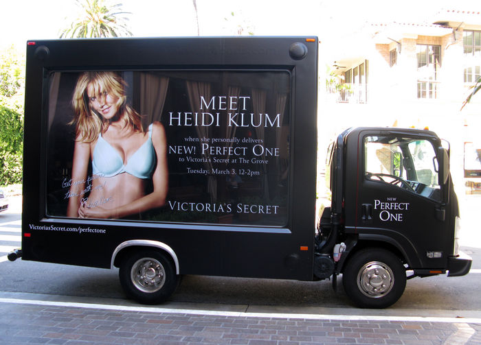 German Model Heidi Klum promoting the  perfect bra . Heidi Klum, Mar 03, 2009 : Heidi Klum Victoria s Secret Mobile. West Hollywood, CAGerman Model Heidi Klum was promoting the perfect bra at The Grove s Victoria s Secret in West Hollywood, CA, but since she was all covered up and not showing her body or The hired security and a sales person, were in front of the store trying to get people to go inside by telling them, but since she was all covered up and not showing her body or the bra, most people didn t show up. The hired security and a sales person, were in front of the store trying to get to the inside by telling them, Me you can get a photo with Heidi Klum for freemo, but once inside people were disappointed when they saw Heidi was not A hunk black male model waited on line to take a photo with Heidi, when his time came he asked Heidi if he could take his shirt off, she said of A disappointed Heidi over the turnout avoided the awaiting paparazzi outside by sneaking throughout the back of the store with heavy security. store with heavy security.Tuesday, March 03, 2009.  Photo by Celebrity Vibe AFLO   2361 .