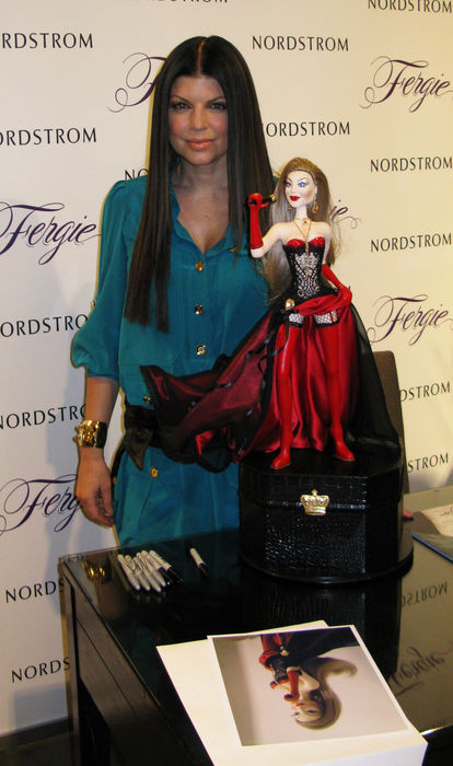 Fergie gets an early birthday gift, a look a like doll of herself from a fan.  Fergie, Mar 21, 2009 : Fergie of Black Eye Peas Band. Fergie promoting her shoe line at Nordstrom Store. The Grove. Hollywood, CA, USA. Saturday, March 21, 2009. While Singer Fergie was promoting her shoe line at Nordstrom in Hollywood a doll designer, Inoe Vargas, brought one for her that looked exactly like Fergie. He waited patiently for an hour while she signed autographs for all her fans that were waiting in line. He finally gave it to Fergie and she loves it. She said,  My birthday is coming up soon and this is my birthday gift, thank you, I love it.   Photo by Celebrity Vibe AFLO   2361 