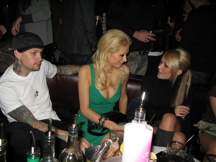Paris Hilton fighting with boyfriend Benji Madden at Nylon Party. Paris Hilton and Benji Madden, Nov 11, 2008 : Paris Hilton and boyfriend Benji Madden fighting, so Paris ignore him. Paris Hilton was fighting all night with boyfriend Benji Madden, she ignored him by turning her back on him while she was sitting on the table and talking and dancing with her girlfriends. Also at the party was her brother,  Barron Nicholas Hilton, and sister Nicky Hilton who came to support her. Nicky Hilton also had a fight with her boyfriend, David Katzenberg, because he wanted to leave and she didn  39 t, so he left around 12 a.m. That gave Nicky the opportunity to dance away with her sister Paris and brother Barron Hilton. DJ AM, was the DJ for the night. Paris Hilton Party for Nylon Magazine. Foxtail Nightclub. West Hollywood, CA, USA. Tuesday,  November 11, 2008.  Photo by Celebrity Vibe AFLO   2361 