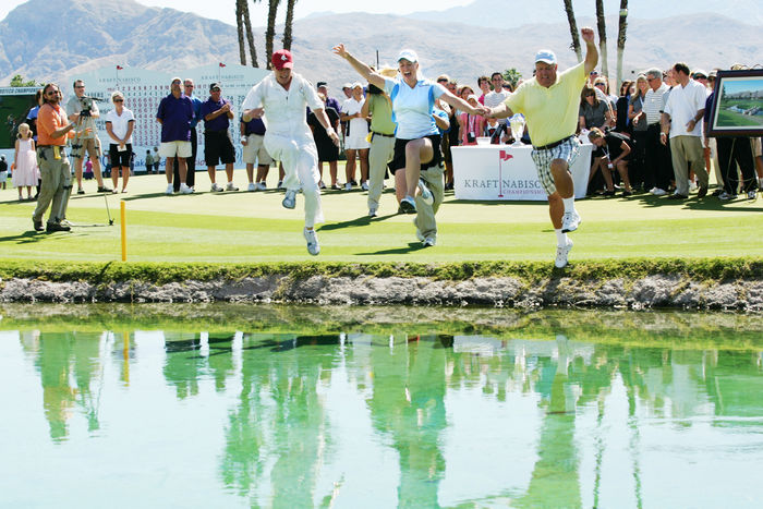 Brittany Lincicome (USA), APRIL 5, 2009 - Golf : Brittany Lincicome (C) jumps in the water surrounding the 18th green after winning with an eagle on the final hole with caddie Tara Bateman and father Tom Lincicome during the final round of the Kraft Nabisco Championship at Mission Hills Country Club in Rancho Mirage, California. (Photo by Yasuhiro JJ Tanabe/AFLO) [2174]