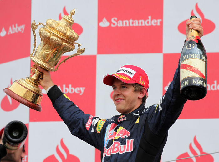 Motorsports   Formula 1: World Championship 2009, GP of England Sebastian Vettel  Red Bull , JUNE 21, 2009   F1 : Sebastian Vettel of Germany and Red Bull Racing celebrates with the trophy on the podium after winning the British Formula One Grand Prix at Silverstone in Northampton, England.  Photo by AFLO   0906      Local Caption         www.hoch zwei.net     copyright: HOCH ZWEI   Juergen Tap    