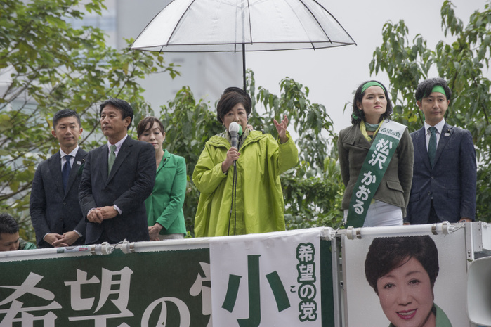 171021 5870   Tokyo Governor Yuriko Koike Tokyo Governor Yuriko Koike  in green raincoat  speaks to support a candidate of her Party of Hope on October 21, 2017 at Shinjuku Station in Tokyo, Japan. This was one of Koike s last street speeches for Japan s Lower House elections of October 22. Photo by DUITS AFLO