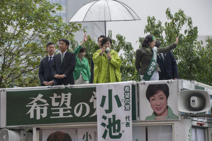 171021 5871   Tokyo Governor Yuriko Koike Tokyo Governor Yuriko Koike  in green raincoat  speaks to support a candidate of her Party of Hope on October 21, 2017 at Shinjuku Station in Tokyo, Japan. This was one of Koike s last street speeches for Japan s Lower House elections of October 22. Photo by DUITS AFLO
