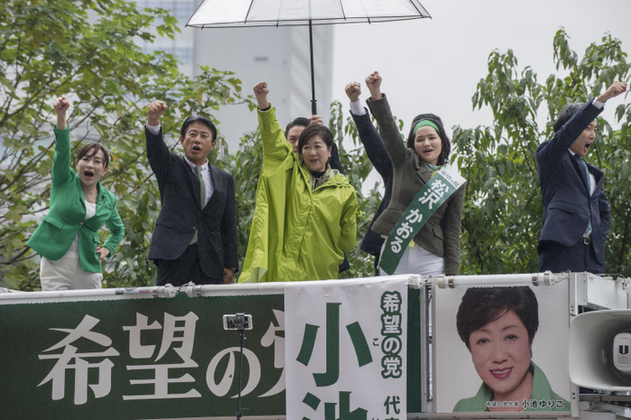 171021 5884   Tokyo Governor Yuriko Koike Tokyo Governor Yuriko Koike  in green raincoat  speaks to support a candidate of her Party of Hope on October 21, 2017 at Shinjuku Station in Tokyo, Japan. This was one of Koike s last street speeches for Japan s Lower House elections of October 22. Photo by DUITS AFLO