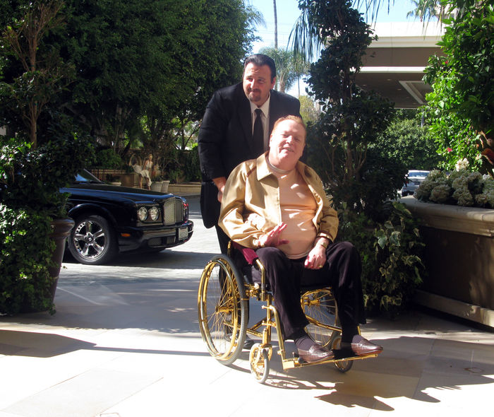 Larry Flynt, Hustle Magazine Publisher, in his 18 karat gold whleechair. Larry Flynt, Apr 19, 2009 : Larry Flynt, Hustle Magazine Publisher, in his 18 karat gold whleechair, being pushed by his driver into the Four Seasons Hotel to meet his wife for an early dinner. Beverly Hills, CA, USA. Wednesday, April 19, 2009.  Photo by Celebrity Vibe AFLO   2361 