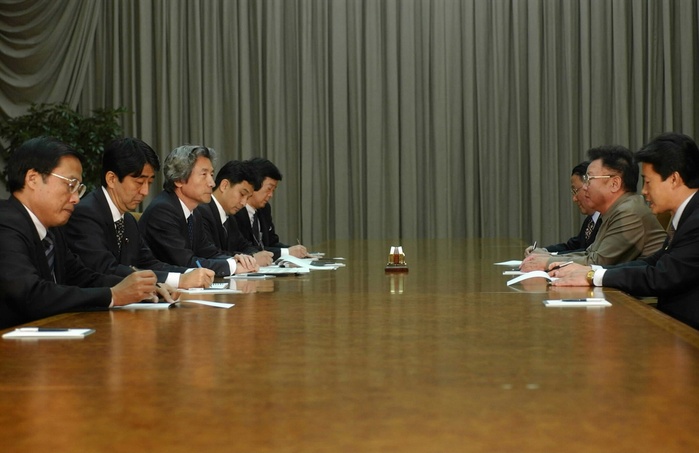 Junichiro Koizumi  September 17, 2002  Prime Minister Junichiro Koizumi visits North Korea. Kim Jong Il  second from right  and Prime Minister Junichiro Koizumi  third from left  at the summit meeting,  Photo by Mainichi  Newspaper AFLO   2400 .