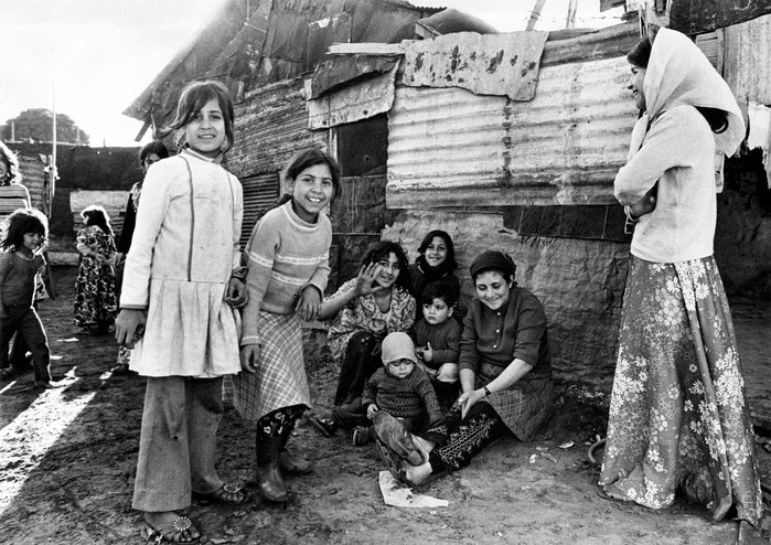 Palestinian refugees. Women and children in a refugee camp, waiting for the day of liberation with surprisingly cheerful expressions even in their tin houses, taken in 1974.