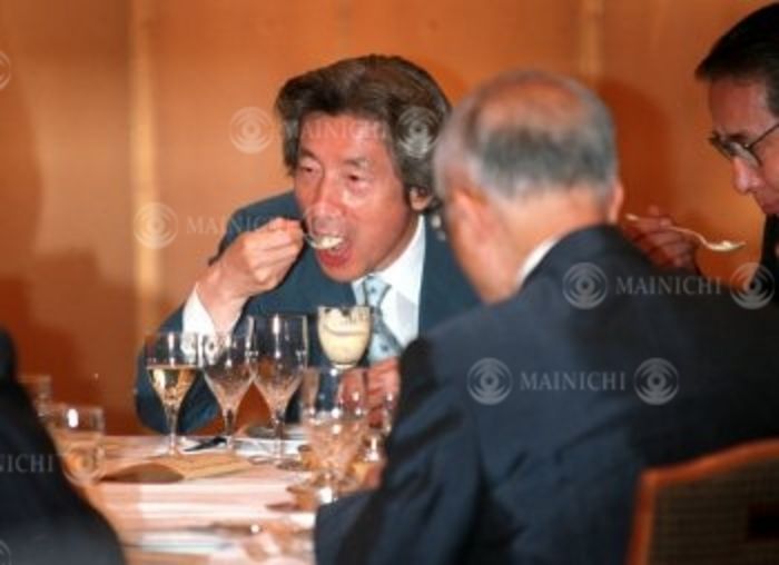 Junichiro Koizumi  July 12, 2002   Prime Minister Junichiro Koizumi and others tasting French cuisine made with Japanese ingredients at the  Brand Nippon Tasting  event  Photo by Mainichi Newspaper AFLO  Prime Minister Junichiro Koizumi and others tasting a sample,  Photo by Mainichi Newspaper AFLO   2400 .