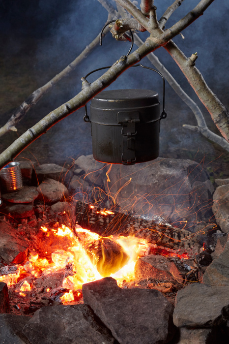 Pot of food cooking over camp fire, close-up, Colgate Lake Wild Forest, Catskill Park, New York State, USA