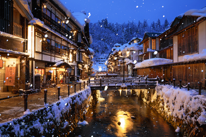 Yamagata Prefecture, Japan Evening view of Ginzan Onsen where it snows