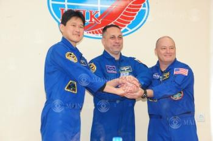 Soyuz MS 07 to be launched  Kanai and others to board Nobushige Kanai  left  holds hands with three Japanese, U.S., and Russian boarders at a hotel in Baikonur, Kazakhstan, December 16, 2017, 5:52 p.m. Photo by Sake Yui