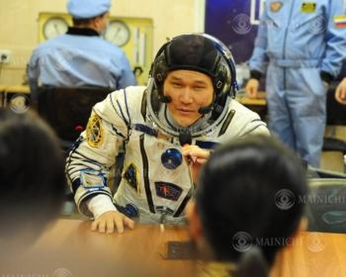 Soyuz MS 07 launched with Kanai and others aboard Nobushige Kanai, wearing a space suit, talks with his parents and fianc e  foreground  at the Baikonur Cosmodrome, Kazakhstan, December 17, 2017, at 0:45 p.m. Photo by Sake Yui