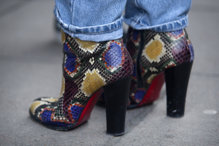 Fall Winter 2018 19 Men s London Street Snapshot Street Style from day one of London Fashion Week Mens AW 2018. Image shows close up detail of a pair of multi colour snake skin ankle boots, by Christian Louboutin.
