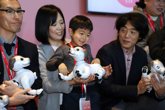 Sony s new  aibo  launched for the first time in 12 years January 11, 2018, Tokyo, Japan   Japanese electronics giant Sony executive officer Izumi Kawanishi  R  and the new owners hold Sony s robot dog  Aibo ERS 1000  as they received at Aibo s launching ceremony at Sony headquarters in Tokyo on Thursday, January 11, 2018. Cloud based artificial intelligence  AI  enables the robot dog to react when spoken to and learn new behavior.  Photo by Yoshio Tsunoda AFLO  LWX  ytd 
