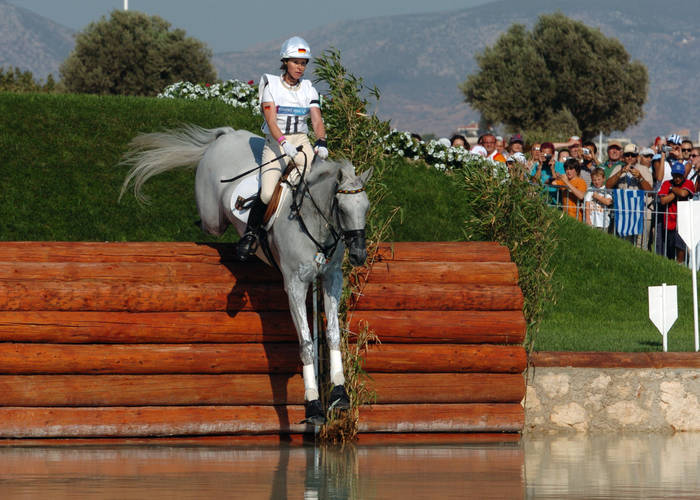 Olympia in Athen 2004 Bettina Hoy  GER , AUGUST 17, 2004   Equestrian : German eventing rider Bettina Hoy and her horse  Ringwood Cockatoo  jump a water obstacle, 17 August 2004, at the Markopoulo Olympic Equestrian Centre in Athens, Greece.  C AFLO FOTO AGENCY  925 
