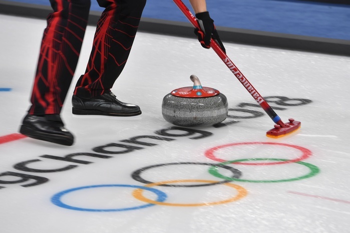 2018 PyeongChang Olympics Curling Mixed Doubles Qualifying Curling action detail wiper broom stone before the Olympic rings generally feature edge motive curling mixed double Round Robin Session1 Gangneung curling Center 08 02 2018 Winter Olympics 2018 from 09 02 25 02 2018 in PyeongChang of South Korea  