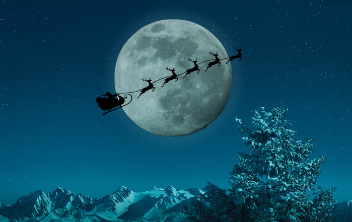 Santa Claus Silhouette of Santa and reindeer flying sleigh near full moon