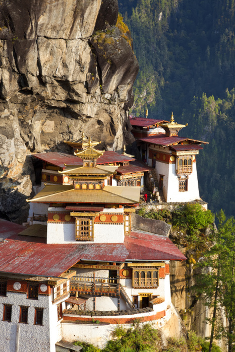 High angle view of  Himalayan Buddhist sacred site and temple complex perched on a vertical rockface. High angle view of  Himalayan Buddhist sacred site and temple complex perched on a vertical rockface.