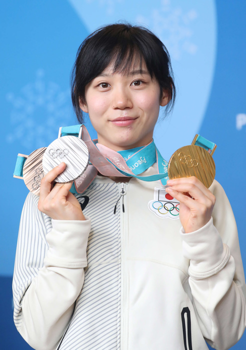 2018 PyeongChang Olympics Speed Skating Medalist Press Conference Miho Takagi poses for a photo with her gold, silver, and bronze medals after a press conference at the PyeongChang Olympics, Feb. 25, 2018 date . 20180225 Photo Location  Pyeongchang Main Press Center