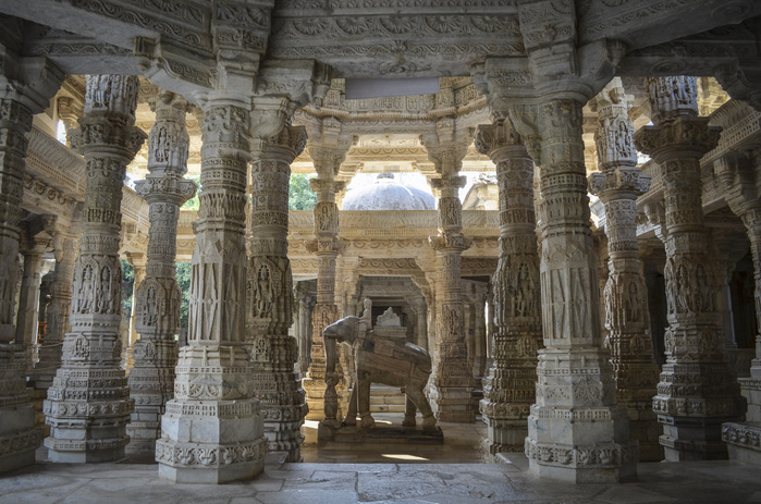Interior view of Ranakpur Jain Temple, Ranakpur. Carvings and marble columns and a statue of an elephant. Interior view of Ranakpur Jain Temple, Ranakpur. Carvings and marble columns and a statue of an elephant.