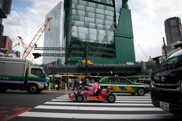 Kart runs through Shibuya Crossing TOKYO, JAPAN   MARCH 23 : A go cart drives in costumes in a traffic road at Shibuya in Tokyo on March 23, 2018. MariCAR Inc. about renting costumes of characters such as  Mario  and the company s name   MariCAR , a Nintendo s popular game  Mario Kart  to the Tokyo District Court.  AFLO  