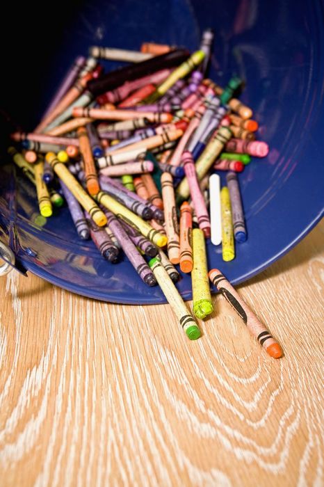 Close-up of crayons spilling out from a container