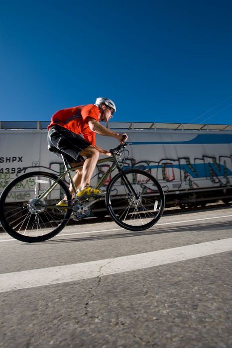Zach Simons road biking near the railroad tracks in Salt Lake City, Utah