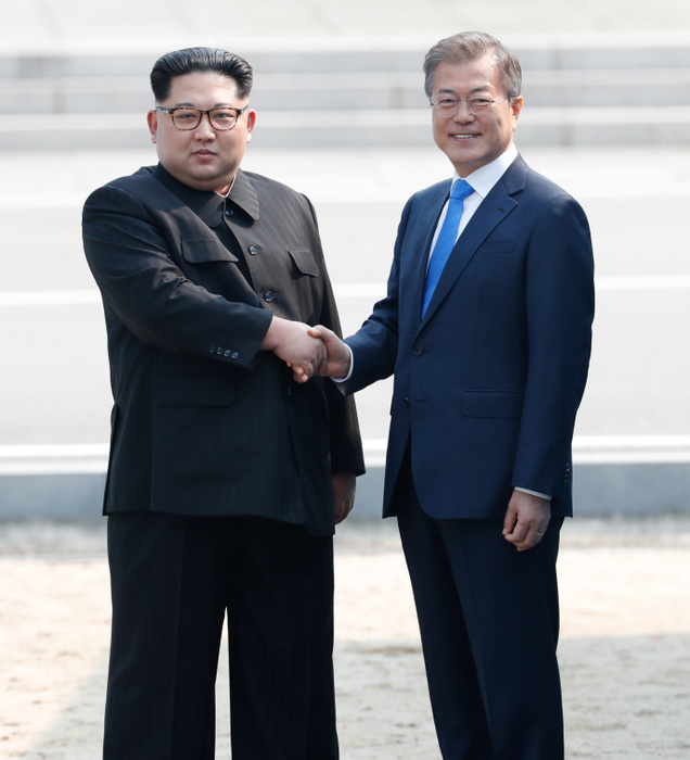 South Korean President Moon and North Korean leader Kim before their inter Korean summit at the Panmunjom in Paju Moon Jae In and Kim Jong Un, Apr 27, 2018 : South Korean President Moon Jae In greets North Korean leader Kim Jong Un  L  after Kim crossed the concrete border before their inter Korean summit at the Panmunjom in the demilitarized zone  DMZ  separating the two Koreas in Paju, north of Seoul, South Korea. EDITORIAL USE ONLY  Photo by Inter Korean Summit Press Corps Pool via Lee Jae Won AFLO   SOUTH KOREA 