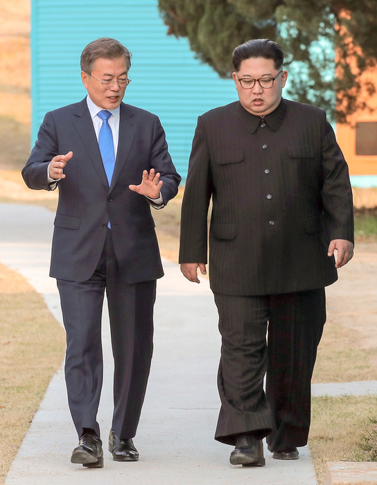 South Korean President Moon and North Korean leader Kim during their inter Korean summit at the Panmunjom in Paju Moon Jae In and Kim Jong Un, Apr 27, 2018 : South Korean President Moon Jae In and North Korean leader Kim Jong Un  R  talk while taking a stroll at the Panmunjom in the Demilitarized Zone  DMZ  separating the two Koreas in Paju, north of Seoul, South Korea. The historic summit ended on Friday with calls for the complete denuclearization of the Korean Peninsula and an immediate halt to all hostile acts, local media reported. EDITORIAL USE ONLY  Photo by Inter Korean Summit Press Corps Pool via Lee Jae Won AFLO   SOUTH KOREA 