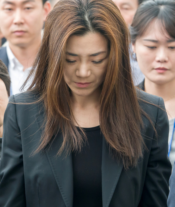 Cho Hyun Min, a senior executive at Korean Air Lines appears to be questioned at a police station in Seoul Cho Hyun Min, May 1, 2018 : Cho Hyun Min  C , a senior executive at Korean Air Lines and the second daughter of its chairman Cho Yang Ho who is also chairman of Hanjin Group, appears to be questioned at Gangseo police station in Seoul, South Korea. Cho Hyun Min is accused of throwing water in the face of an ad agency manager during a meeting in March. Cho Yang Ho offered a public apology due to mounting public outrage over his daughter Cho Hyun Min who is the younger sister of Cho Hyun Ah, who gained global notoriety for the  nut rage  incident in 2014. Cho Hyun Ah forced a plane back to the boarding gate at New York s John F. Kennedy International Airport because she was upset with the way her nuts were served. South Korea s customs office has been investigating allegations that family members of Hanjin Group Chairman Cho have smuggled luxury goods into the country without properly paying duties, local media reporetd.  Photo by Lee Jae Won AFLO   SOUTH KOREA 