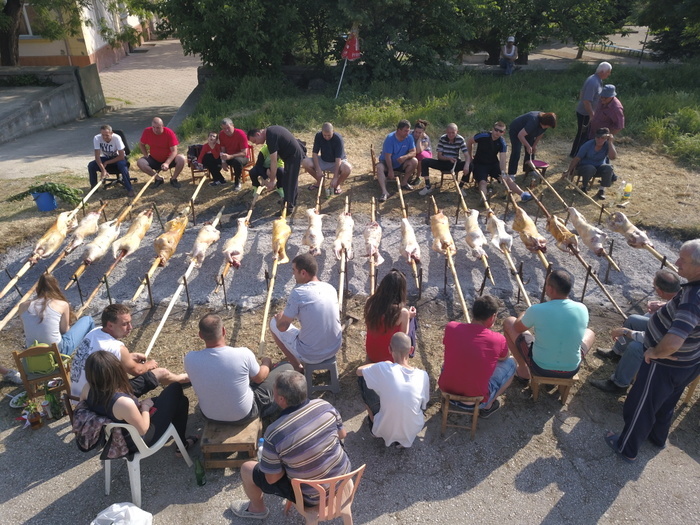 Bulgaria St George s Day People sit and roast lambs lambs on spits, a traditional activity on St George s day, in the village of Patalenica, some 110 kms east of the Bulgarian capital Sofia, May 6, 2018 Possibly the most celebrated name day in the country, St George s Day is a public holiday that takes place on May 6 each year. Bulgaria celebrates the Saint George s Day as a day of Bulgarian Army bravery also. Photo by: Petar Petrov  Impact Press Group 