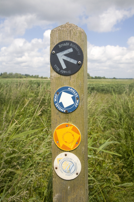 Route markers for Angles Way long distance footpath in marshes near Oulton Broad, Suffolk, England