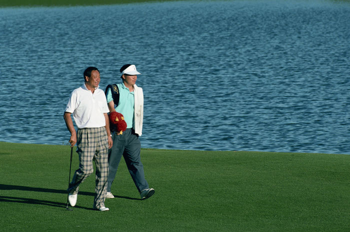 (L to R) Eiichi Itai, Caddie Andy Wada, circa 1995 - Golf : (Photo by AFLO) [0243]