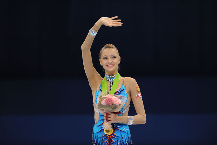 World Rhythmic Gymnastics Championships Individual Hoop Award Ceremony . Evgenia Kanaeva  RUS , SEPTEMBER 8, 2009   Rhythmic Gymnastics : Evgenia Kanaeva of Russia celebrates with gold medal on the podium after winning in the individual hoop competition final during the Rhythmic Gymnastics World Championships 2009 at MIE prefectural Sun Arena in Mie, Japan.  Photo by Hitoshi Mochizuki AFLO   0449 