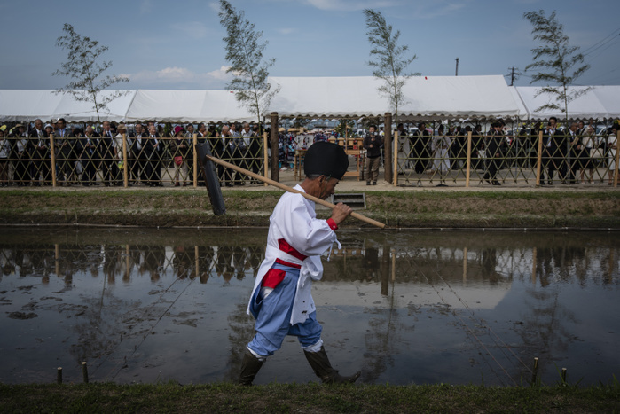 Japanese Rice Planting Ceremony JUNE 3, 2018   A man walks next to a rice field during Yuki Saiden O taue Matsuri, a rice planting ceremony and festival in Okazaki, Japan.   The festival takes place at a special rice field for Shinto dieties called a saiden. Similar events are held during the rice planting season throughout Japan.  While most rice planting in Japan is now done by machine, festival participants plant rice by hand. They also wear traditional clothing, and perform traditional song and dance.  Photo by Ben Weller AFLO   JAPAN   UHU 