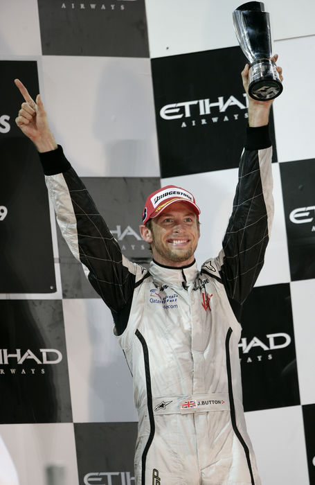 Abu Dhabi GP Button 3rd  Jenson Button  Brawn GP , NOVEMBER 1, 2009   F1 : Third placed Jenson Button of Great Britain and Brawn GP celebrates with the trophy on the podium after the Abu Dhabi Formula One Grand Prix at the Yas Marina Circuit in Abu Dhabi, United Arab Emirates.  Photo by AFLO   0906      Local Caption         www.hoch zwei.net     copyright: HOCH ZWEI   Juergen Tap    