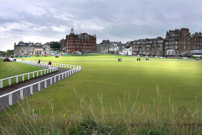 St. Andrews Old Course 1st and 18th holes A  sacred place  for golf, it is also the home of the R A, the head office of the Rules. Originally a 22 hole course, it was converted to an 18 hole course in 1764 and It set the standard for subsequent courses. The 18 hole, 6721 yard, par 72 course was improved by Dow Anderson, Tom Morris Sr. and others. 18 holes, 6721 yards, par 72. St Andrews Old Course, JULY 22, 2009   Golf : A general view of the 1st and 18th holes with the Royal and Ancient Golf Club of St Andrews Clubhouse, Hamilton Hall and the Macdonald Rusacks Hotel on the Old Course at St Andrews in St Andrews, Fife, Scotland. A view of the R A clubhouse and other facilities from the vast shared fairways of No. 1 and No. 18.