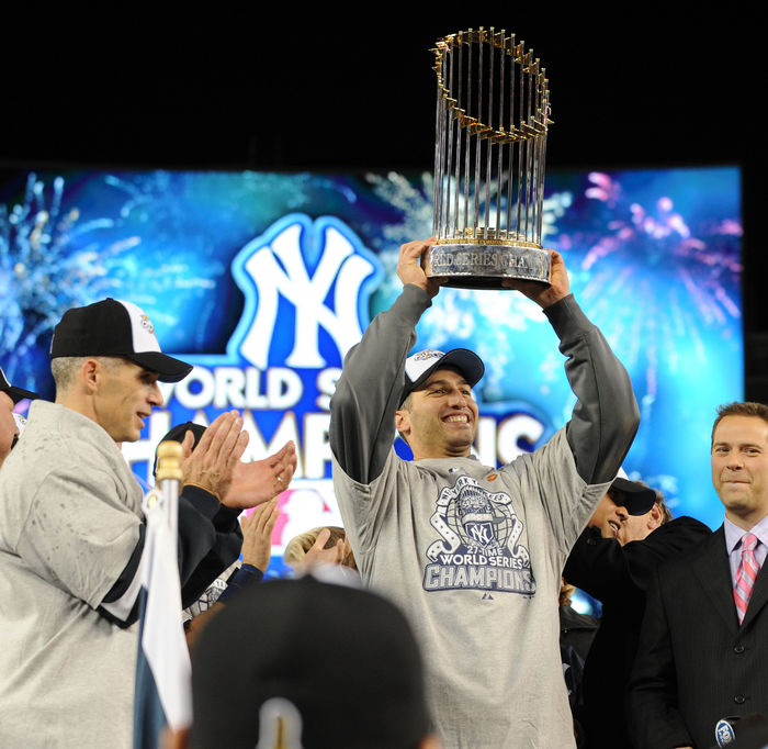 Yankees World Series Champion  Andy Pettitte  Yankees , NOVEMBER 4, 2009   MLB : Andy Pettitte of the New York Yankees celebrates with the trophy as Yankees  39  manager Joe Girardi is seen after the Yankees defeated the Philadelphia Phillies in Game 6 to win the 2009 Major League Baseball World Series at New Yankee Stadium in the Bronx, NY, USA.  Photo by AFLO   2324 